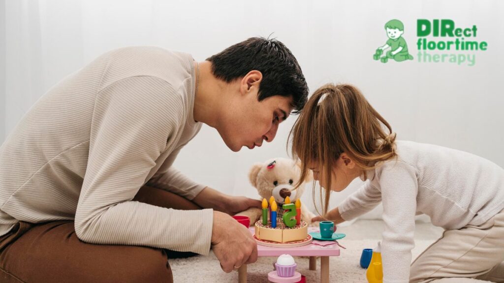 A father or male therapist bends over toy blocks with a child, using the DIR Floortime model to build developmental skills.