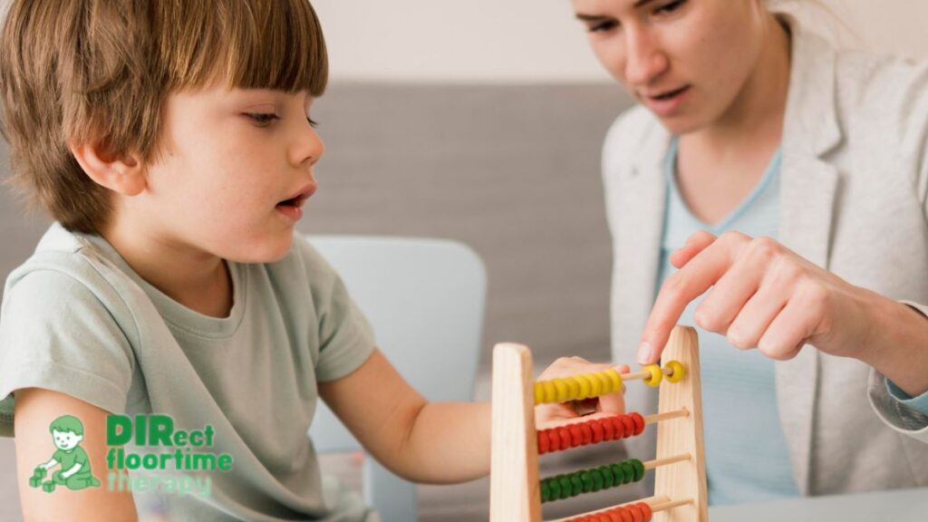 Play therapy NJ session with a young boy building a tower of blocks to support learning and growth.