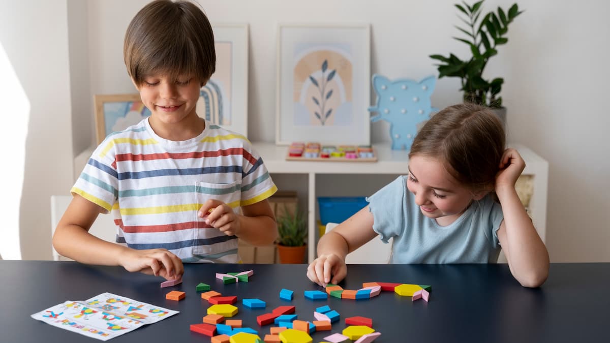 A girl and a boy playing with legos