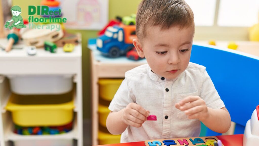 School readiness autism, a young preschool child working on puzzle pieces at a table during a school readiness program.