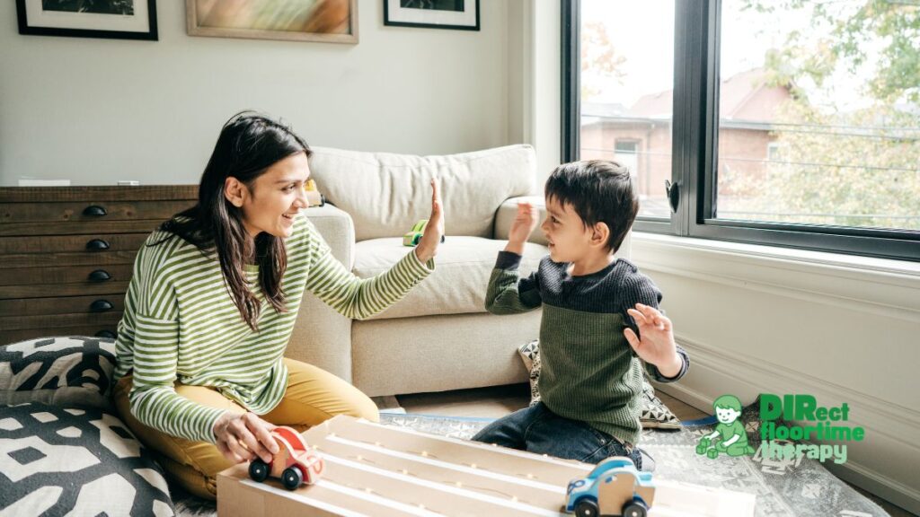 Mother and child engaging in playful DIRFloortime interaction with toy cars during parent coaching session to support communication, social connection, and developmental growth at home in New Jersey.
