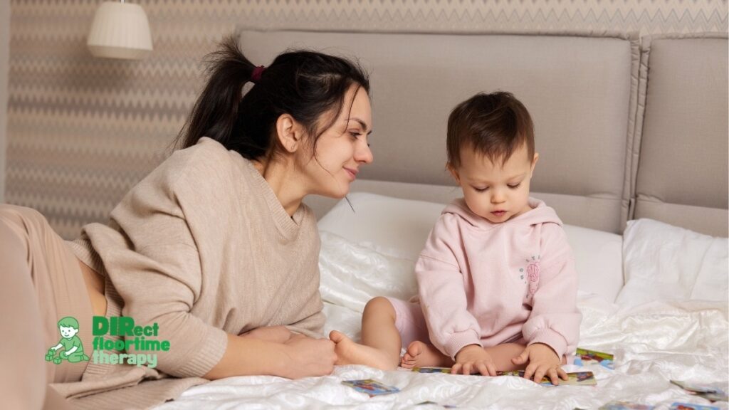 A warm, connected moment between a mother and her young child sitting on a bed together, highlighting relationship-based bedtime support for autism.