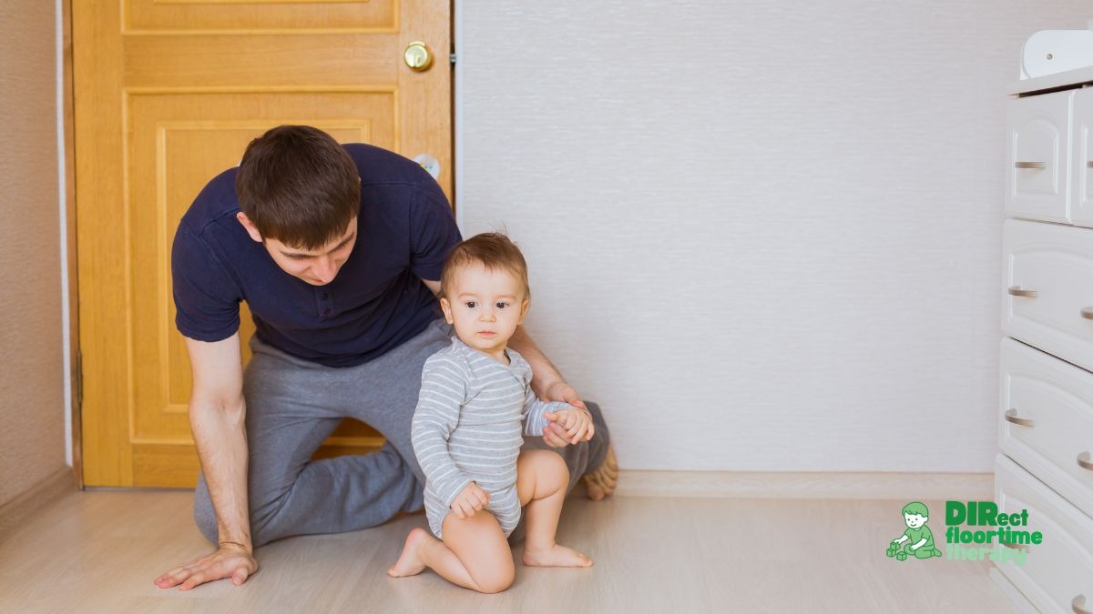 parent crouching to child's level, calm expression, child appears distracted or overwhelmed. Warm indoor lighting.